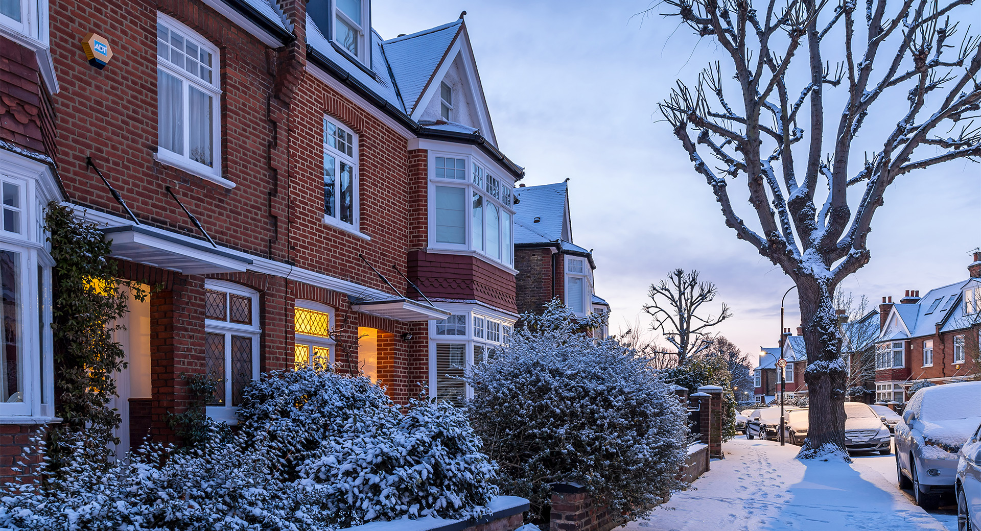  A residential street on a snowy winter's day
                        