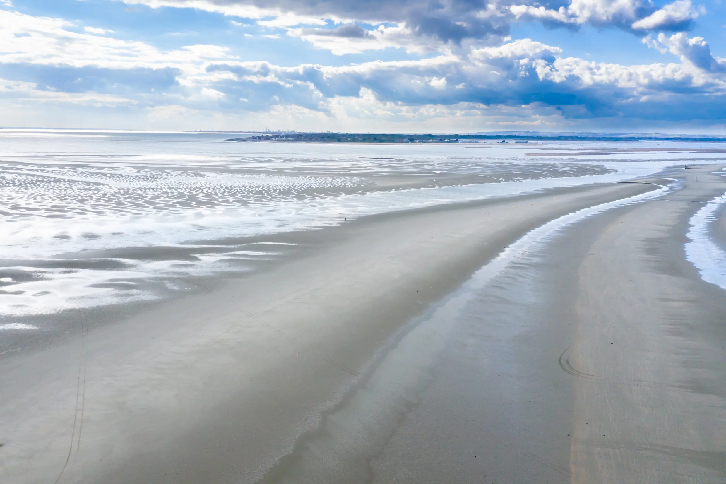 An aerial view of a person walking on West Wittering Beach