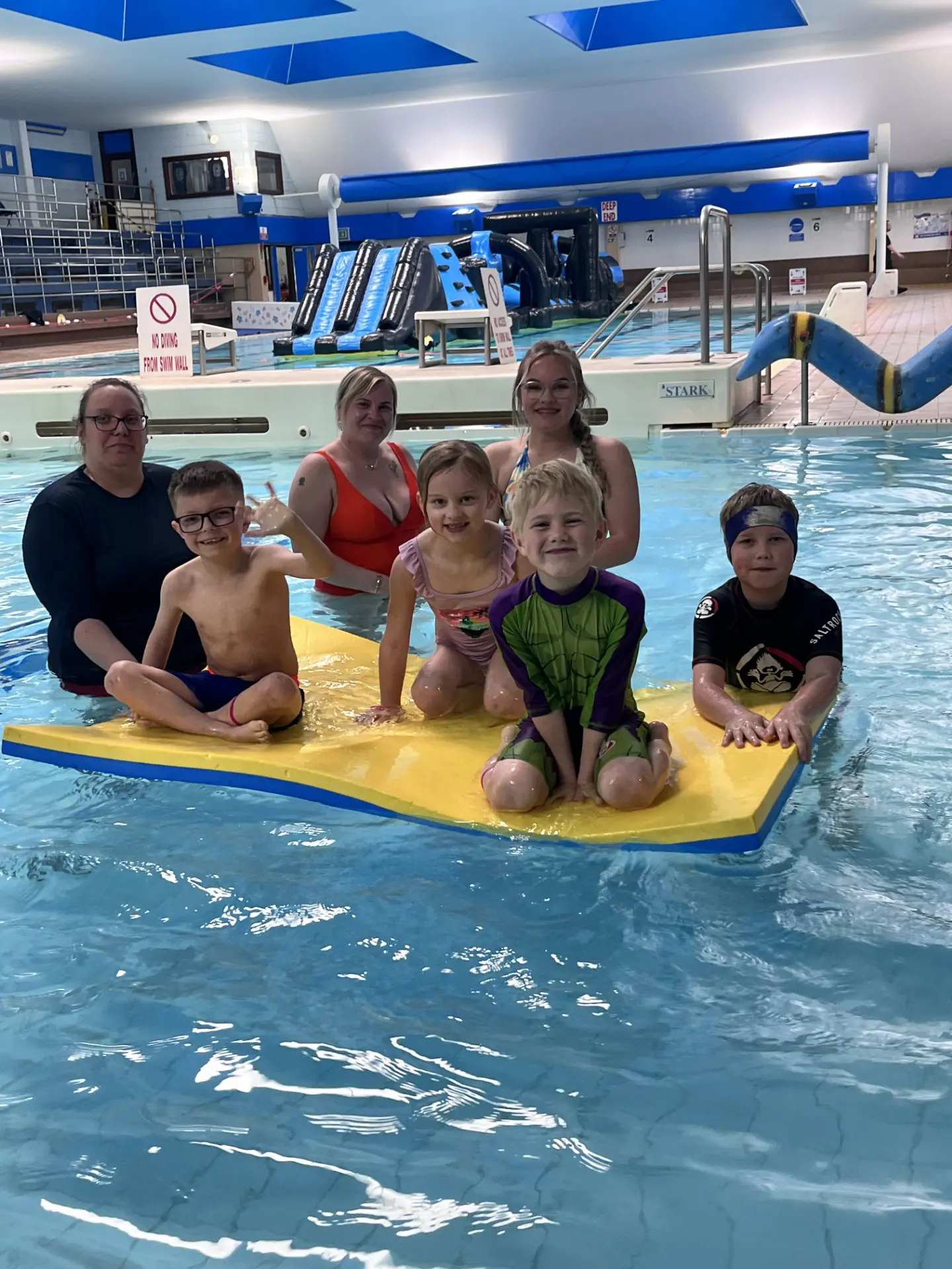 Families at inflatable fun swimming lessons in Hastings 