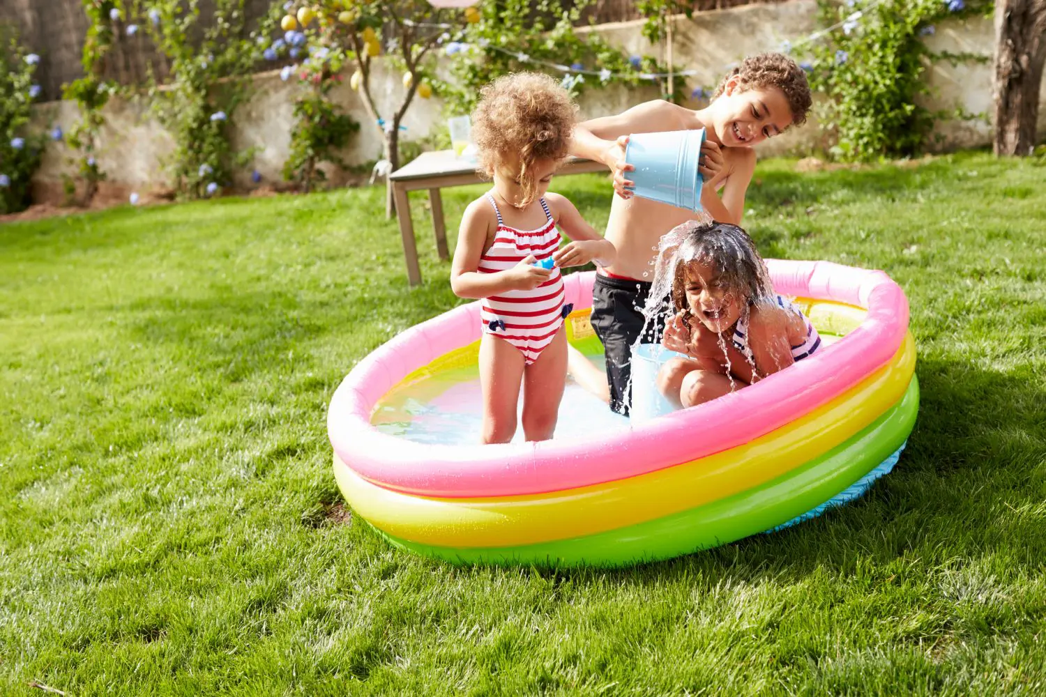 Kids playing in a paddling pool