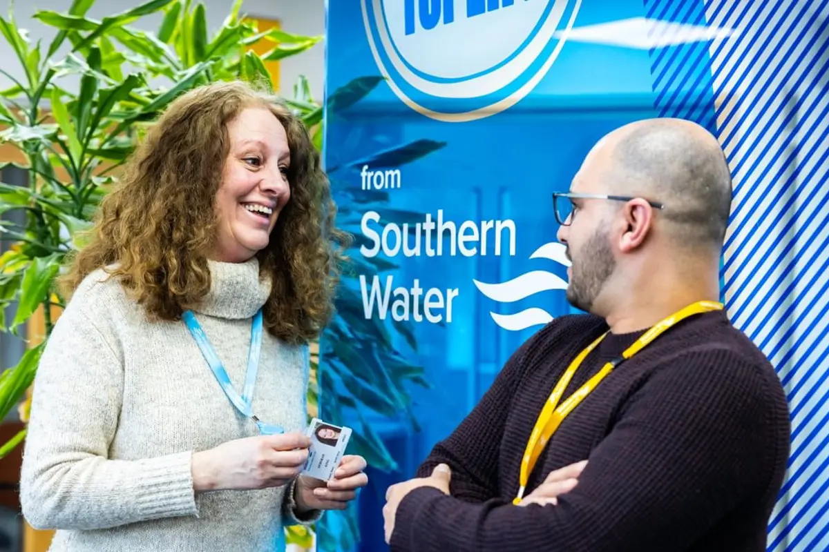 man and woman talking in Southern Water office 